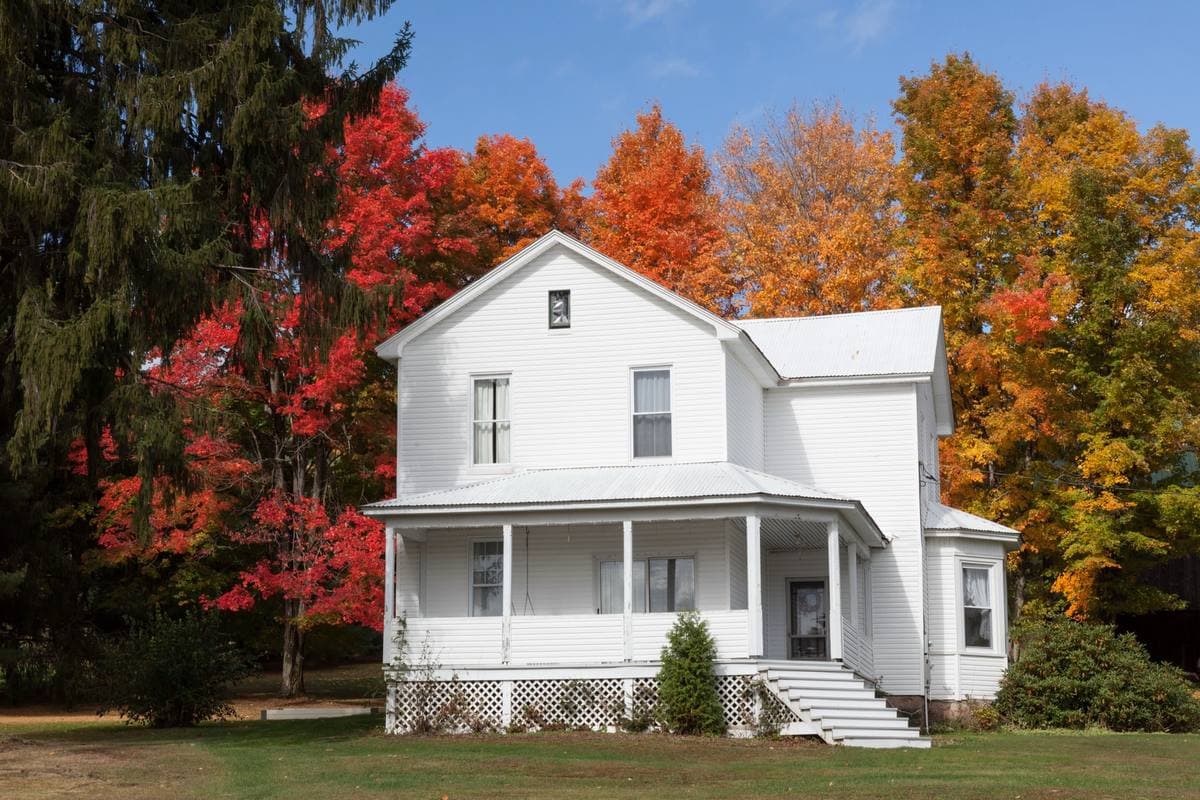 A colonial home with painted siding and a wide lawn in Framingham, Massachusetts